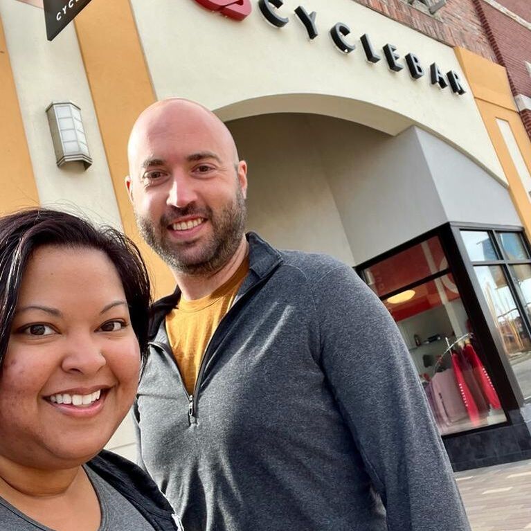 JulieMarie Shepherd Macklin and husband in front of CycleBar Southlands